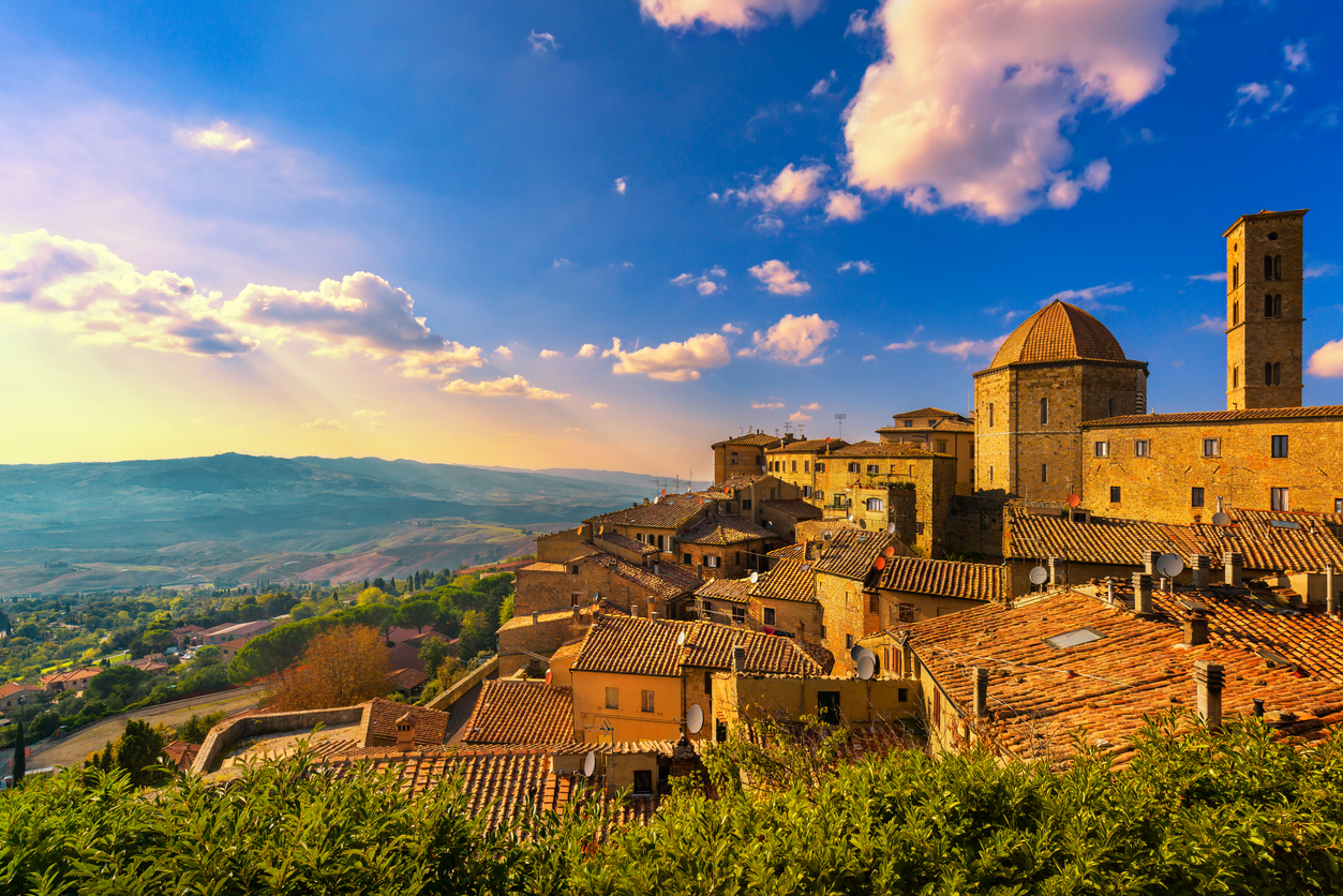 Tuscany, Volterra town skyline, church and panorama view on sunset. Italy